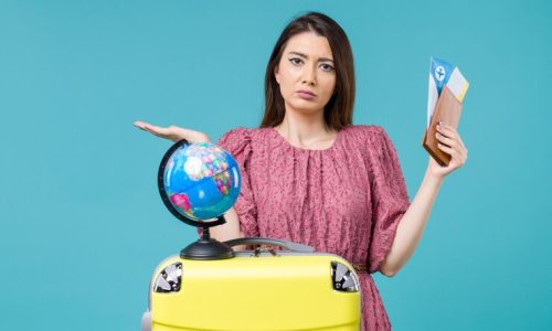 front-view-female-vacation-holding-her-wallet-ticket-light-blue-background-sea-trip-vacation-woman-journey-voyage_140725-89297